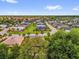 An aerial view displays the community's well-maintained streets and lush landscaping at 10367 Addison Shore Way, Oxford, FL 34484
