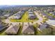 Scenic aerial view of the neighborhood, featuring well-maintained lawns and landscaping surrounding each home at 10367 Addison Shore Way, Oxford, FL 34484