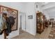 Inviting hallway featuring tiled floors, decorative accents, and an open doorway to another room at 10367 Addison Shore Way, Oxford, FL 34484