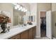 Well-lit bathroom with a long vanity, a spacious shower, and access to the closet at 6109 Apollos Corner Way, Orlando, FL 32829