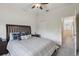 Relaxing bedroom with neutral walls, plush carpet, and a ceiling fan for added comfort at 6109 Apollos Corner Way, Orlando, FL 32829