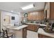 Modern kitchen with a breakfast bar, stainless steel appliances, and ample counter space at 6109 Apollos Corner Way, Orlando, FL 32829