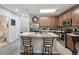 Bright kitchen featuring an island with seating, stainless steel appliances and wood cabinets at 6109 Apollos Corner Way, Orlando, FL 32829