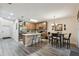Inviting kitchen featuring an island with seating, stainless steel appliances and tile backsplash at 6109 Apollos Corner Way, Orlando, FL 32829