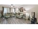 Comfortable living room with stylish decor, natural light, and modern vinyl flooring at 6109 Apollos Corner Way, Orlando, FL 32829