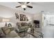 Bright living room with stylish decor, fan, and modern vinyl flooring at 6109 Apollos Corner Way, Orlando, FL 32829