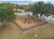 Neighborhood playground with multiple slides, swing set, and climbing structure within a black metal fenced area at 6109 Apollos Corner Way, Orlando, FL 32829