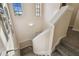 Bright staircase with neutral carpet and white railings leading to the upper level at 6109 Apollos Corner Way, Orlando, FL 32829