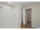 Bright bathroom featuring a walk-in shower, wood-look flooring and adjacent toilet and closet at 1022 Foreshore Ln, Haines City, FL 33844