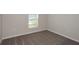 Comfortable bedroom featuring neutral carpeting, a bright window and updated electrical outlets at 1022 Foreshore Ln, Haines City, FL 33844