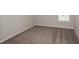 Neutral bedroom with plush carpeting, a window with blinds, and updated electrical outlets at 1022 Foreshore Ln, Haines City, FL 33844