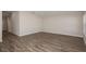 An empty living room featuring wood floors and light neutral walls at 1022 Foreshore Ln, Haines City, FL 33844