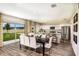 Dining area with sliding glass doors to backyard and an open view to the kitchen with stainless steel appliances at 1030 Foreshore Ln, Haines City, FL 33844