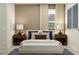 Cozy bedroom with neutral tones, stylish decor, and ample natural light from a window at 1313 Acorn Meadow Loop, Eustis, FL 32726