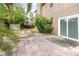 View of backyard with brick pavers and grass lawn at 1300 Holly Glen Run, Apopka, FL 32703