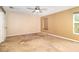 Large bedroom with a ceiling fan and neutral walls at 1300 Holly Glen Run, Apopka, FL 32703