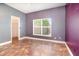 Bright bedroom with a window and tiled flooring at 1300 Holly Glen Run, Apopka, FL 32703