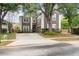 Two-story home with brown siding, white trim, attached two-car garage and concrete driveway at 1300 Holly Glen Run, Apopka, FL 32703