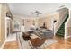 Inviting living room with a fireplace, plush gray sofa, and modern decor at 1300 Holly Glen Run, Apopka, FL 32703