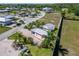 Aerial view showcasing a home with a brick driveway, patio and a well maintained lawn at 2991 Wood Duck Dr, Polk City, FL 33868