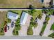 Aerial view showing the backyard, additional building and brick paved driveways at 2991 Wood Duck Dr, Polk City, FL 33868