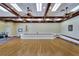 Empty ballroom with a stage, ramp, and an American flag at 2991 Wood Duck Dr, Polk City, FL 33868
