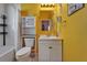 Vibrant bathroom with a modern vanity, toilet, shower and bath combo at 2991 Wood Duck Dr, Polk City, FL 33868