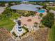 Stunning clubhouse featuring a pool, a fire pit and meticulous landscaping, perfect for relaxation and entertainment at 2991 Wood Duck Dr, Polk City, FL 33868