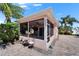 Charming home featuring a screened-in patio with ceiling fan and lush landscaping at 2991 Wood Duck Dr, Polk City, FL 33868
