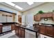 Functional kitchen with a center island, granite countertops, and plenty of cabinet space for storage at 2991 Wood Duck Dr, Polk City, FL 33868