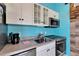Well-equipped kitchen with stainless steel appliances, sleek countertops, and ample cabinetry for storage at 2991 Wood Duck Dr, Polk City, FL 33868