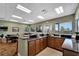 Clubhouse kitchen with stainless steel sink, dark granite counters and lots of storage at 2991 Wood Duck Dr, Polk City, FL 33868