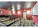 Private movie theater with tiered seating and a projector at 2991 Wood Duck Dr, Polk City, FL 33868