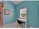 Bright office space with a modern desk, black office chair, and a large window for natural light at 2991 Wood Duck Dr, Polk City, FL 33868