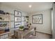 Stylish office with a modern desk, shelving, and motivational decor at 3766 King Hill Dr, Haines City, FL 33844