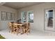 Covered patio area with a dining table, offering an ideal outdoor space for relaxing at 3766 King Hill Dr, Haines City, FL 33844