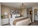 Cozy main bedroom featuring two windows, a decorative light fixture, and neutral decor at 3787 King Hill Dr, Haines City, FL 33844