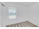 Neutral bedroom with a window providing natural light and plush carpet flooring at 9084 Wildlight Trl, Wildwood, FL 34785