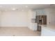 Open floor plan with an eat-in kitchen featuring a stainless steel refrigerator and tile flooring at 9084 Wildlight Trl, Wildwood, FL 34785