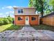 Exterior view of the backyard and the rear of a two-story home at 156 Oak Grove Rd, Winter Park, FL 32789