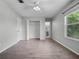Spacious bedroom featuring wood-look flooring and a closet with ample storage space at 156 Oak Grove Rd, Winter Park, FL 32789