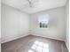 Clean bedroom with laminate wood flooring and a large window offering an abundance of light at 156 Oak Grove Rd, Winter Park, FL 32789