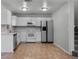 Kitchen with stainless appliances and white cabinetry at 156 Oak Grove Rd, Winter Park, FL 32789