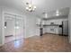 Open concept kitchen with stainless appliances and tile floors at 156 Oak Grove Rd, Winter Park, FL 32789