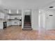 Open concept living room with view of staircase and kitchen at 156 Oak Grove Rd, Winter Park, FL 32789