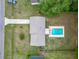 This aerial view highlights a spacious yard with a patio and a beautiful inground pool at 2690 Ne 42Nd Pl, Ocala, FL 34479