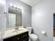 Bathroom features a modern vanity, a toilet and neutral walls at 2690 Ne 42Nd Pl, Ocala, FL 34479