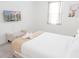 Bright bedroom featuring a king-size bed, modern decor, and ample natural light for relaxation at 4149 Paragraph Dr, Kissimmee, FL 34746