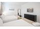 Bright and airy bedroom with two beds, dark dresser, and modern decor for a comfortable stay at 4149 Paragraph Dr, Kissimmee, FL 34746