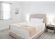 Comfortable bedroom with a beige bed, neutral decor and bedside tables with lamps at 4149 Paragraph Dr, Kissimmee, FL 34746